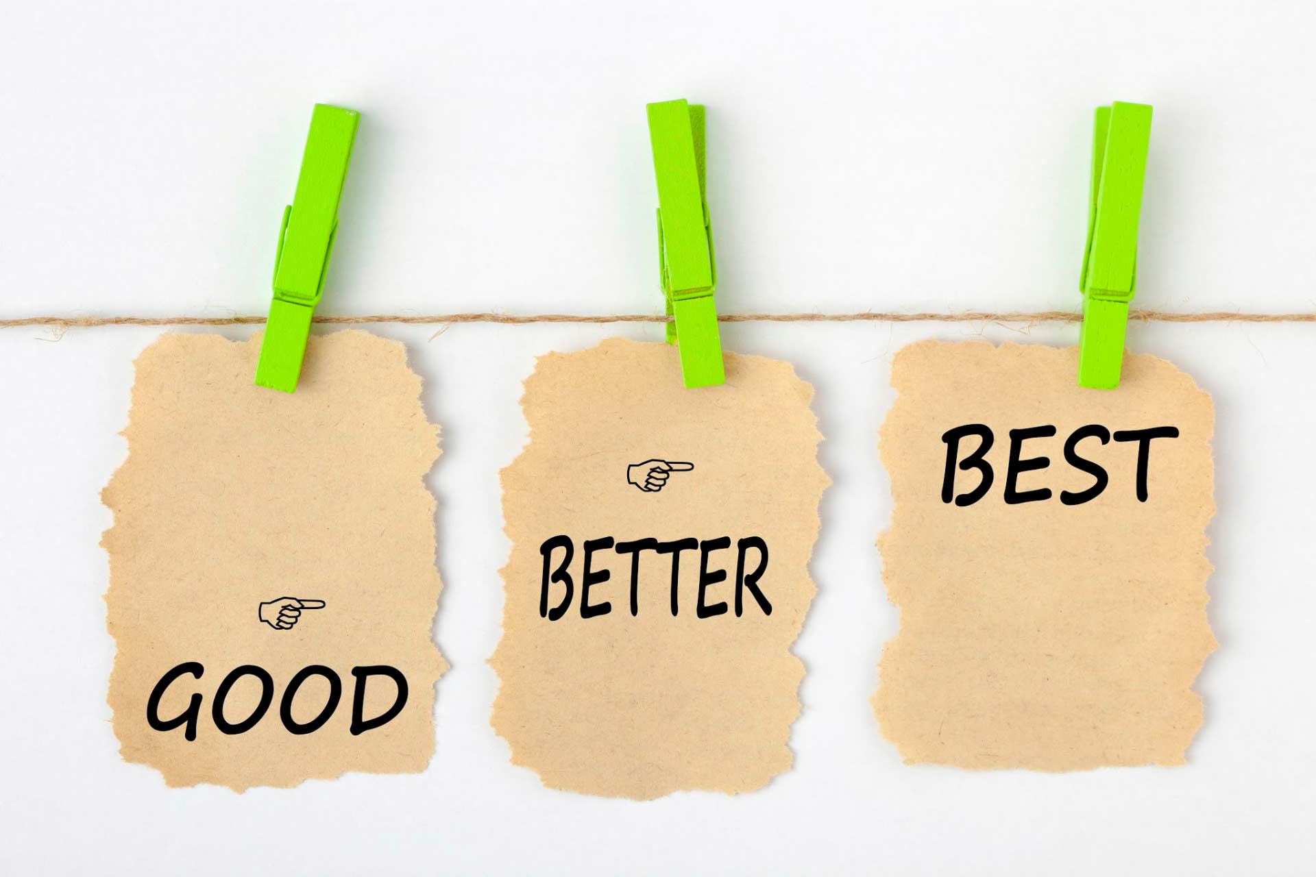 Clothesline with 3 signs saying “Good,” “Better,” and “Best,” symbolizing the challenge of finding the best solution for sleep.