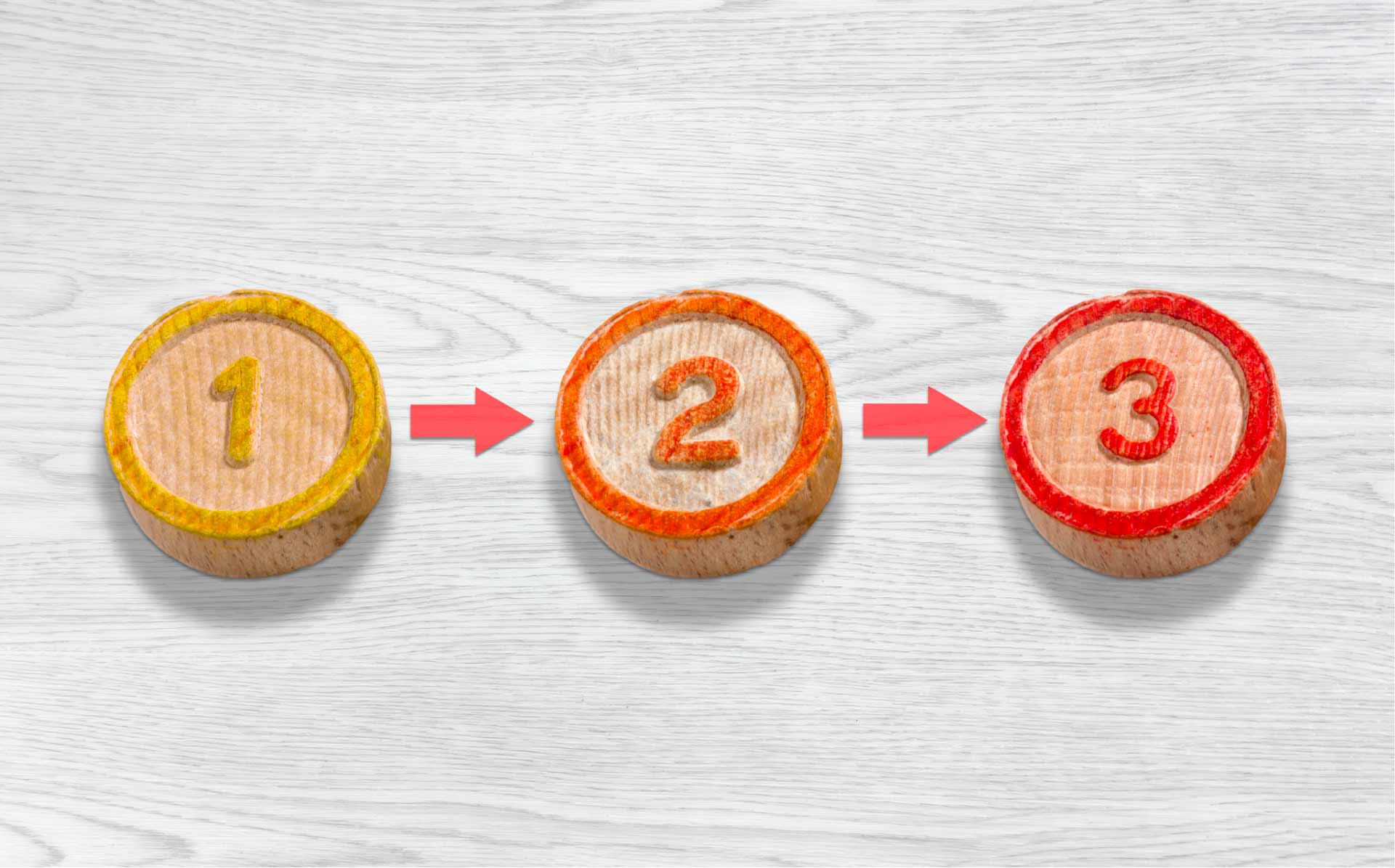 Round wooden buttons numbered ‘1,’ ‘2,’ and ‘3’ representing steps in the state medical marijuana application process.