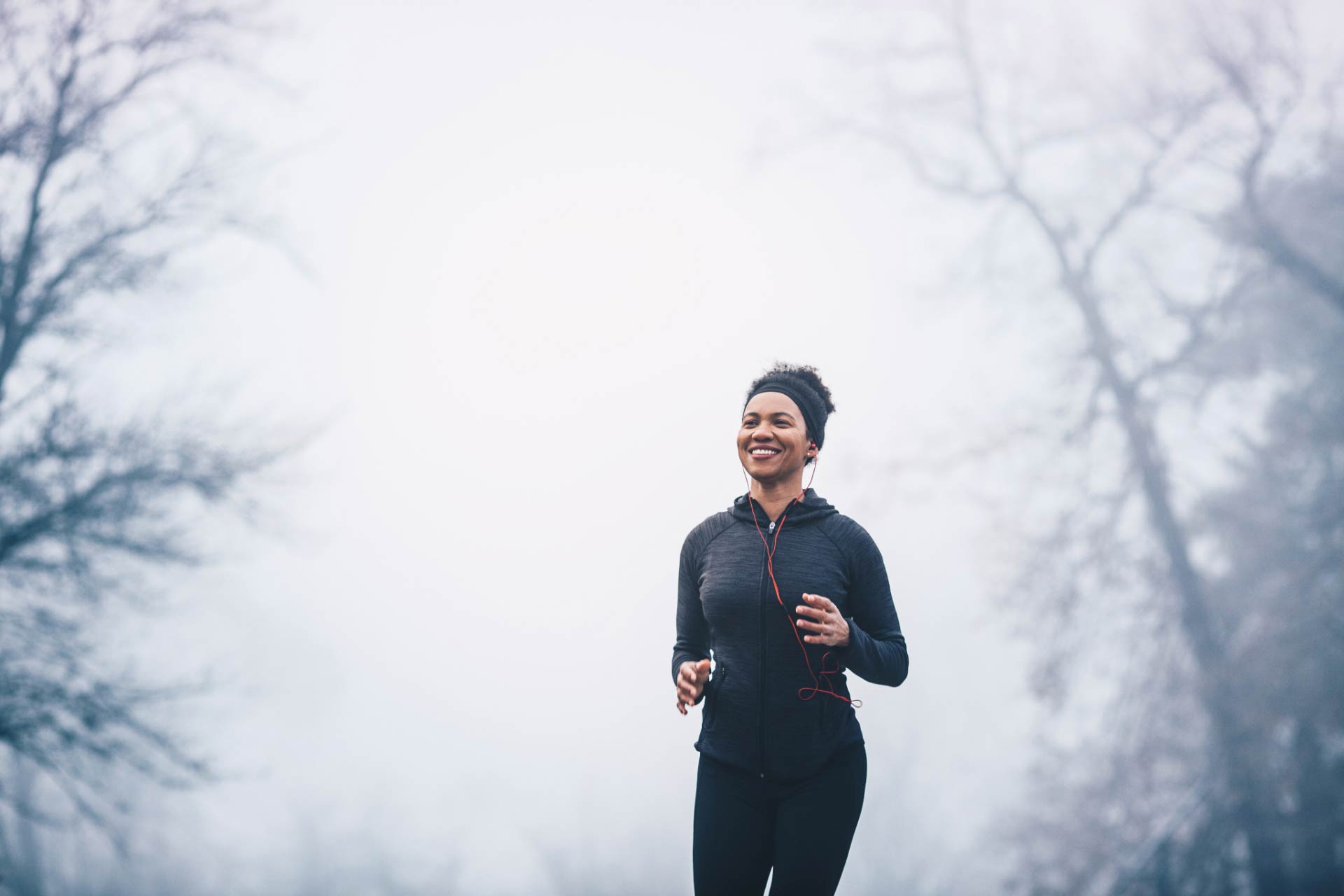 Happy woman on a morning run boosted by the positive effects of cannabis