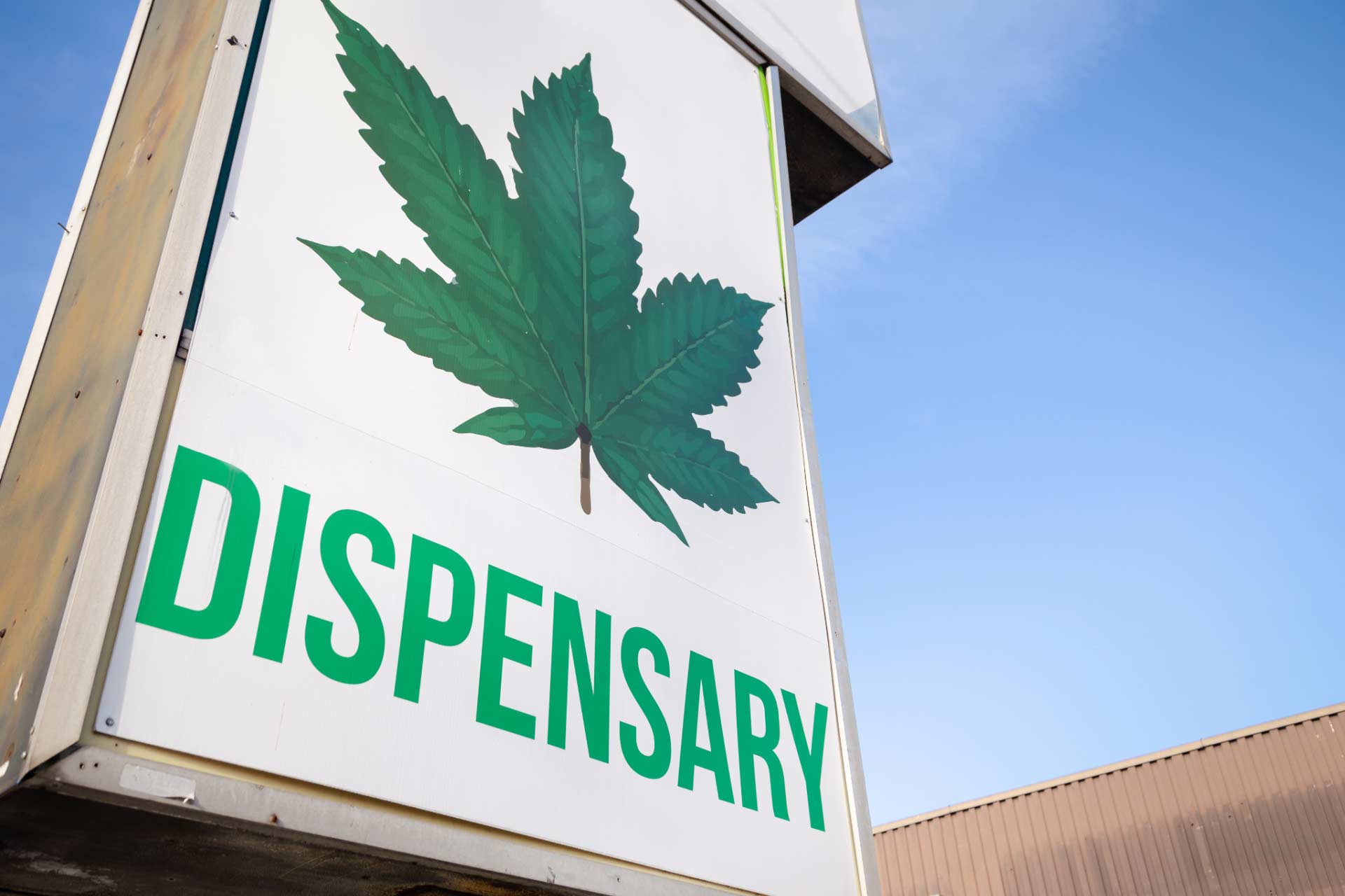 Dispensary sign. Save money by knowing where to find dispensary deals and specials.