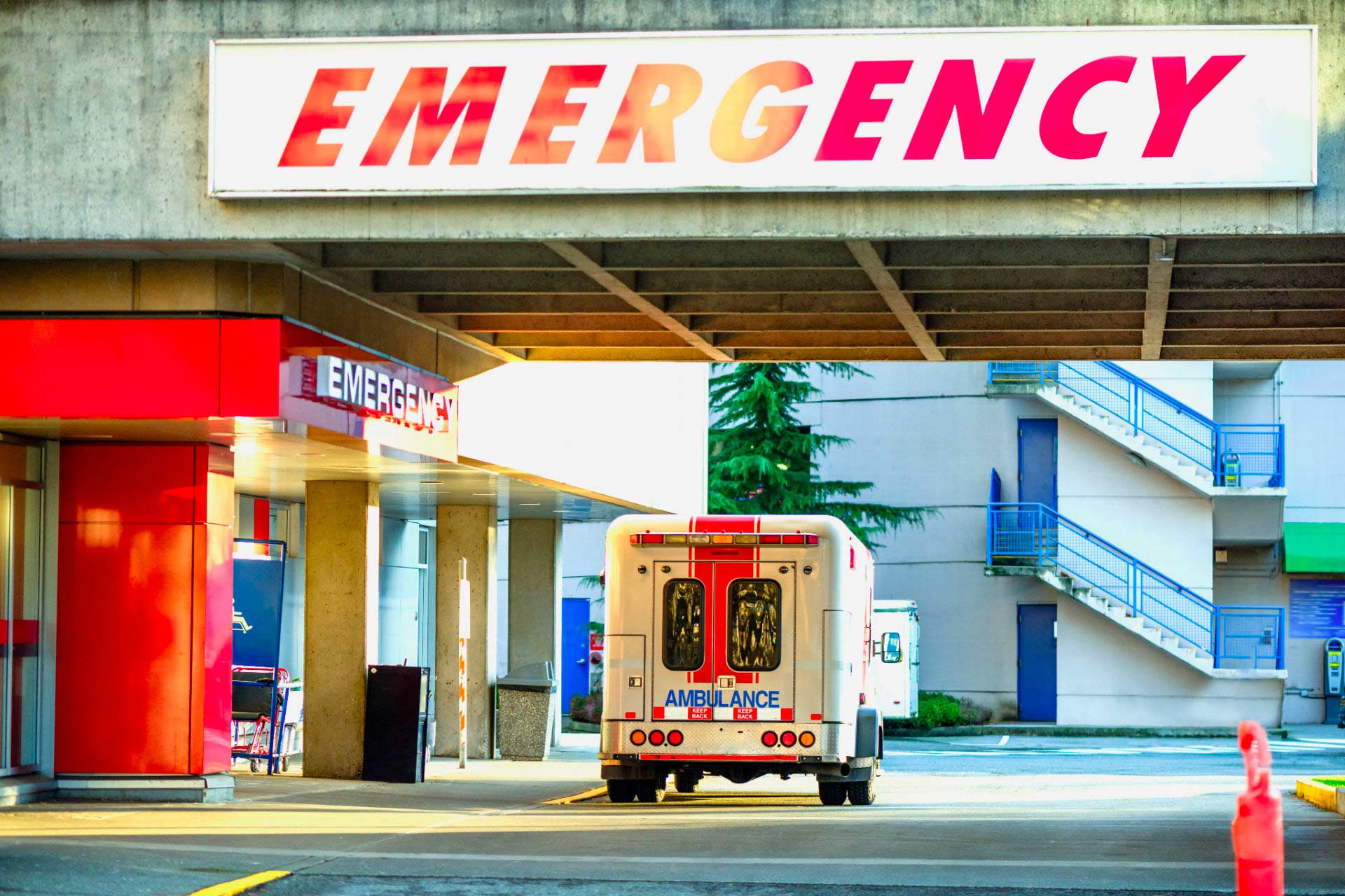 Hospital Emergency Room doorway with ambulance parked in front