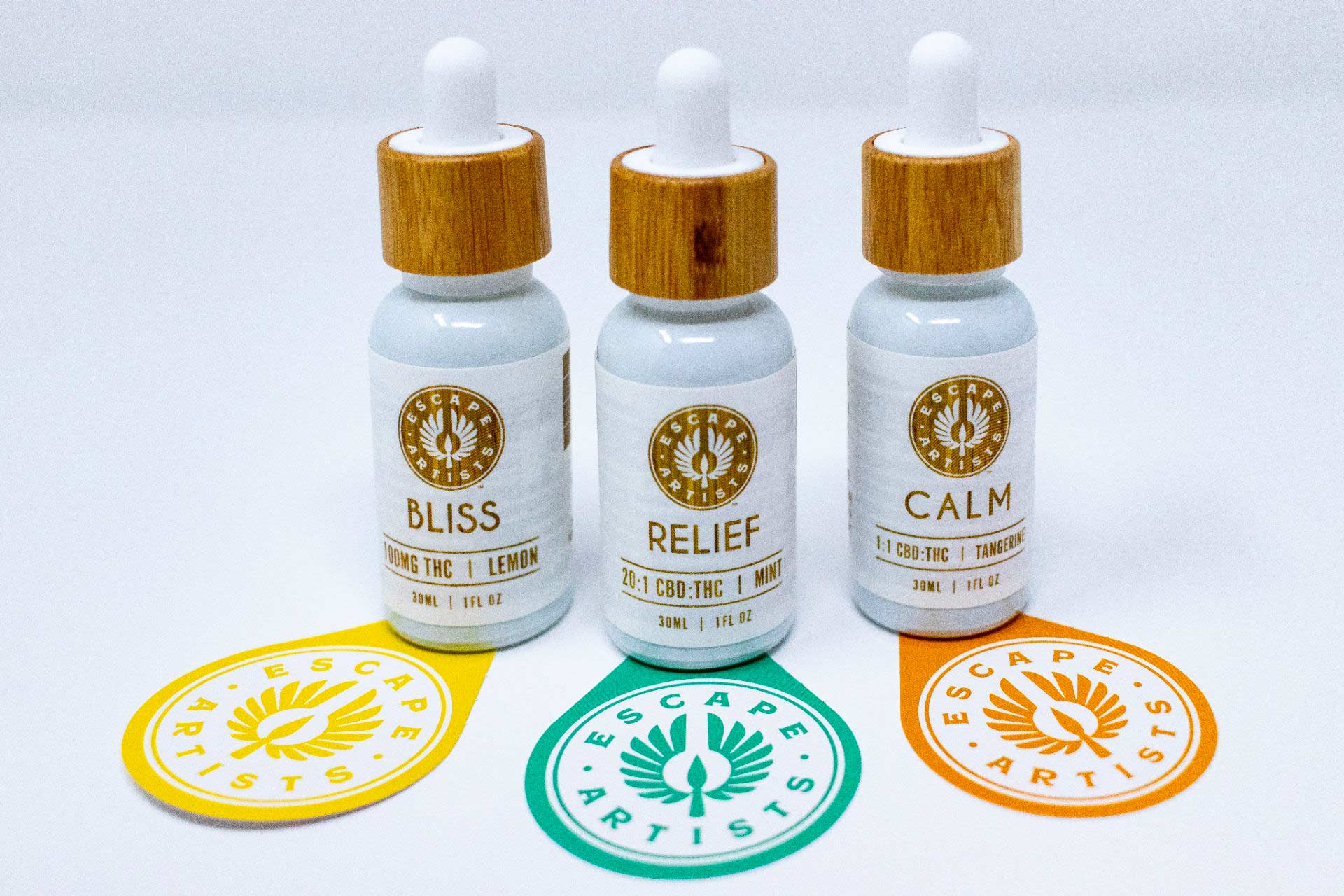 Escape Artist cannabis tincture bottles for their Bliss, Relief and Calm blends.