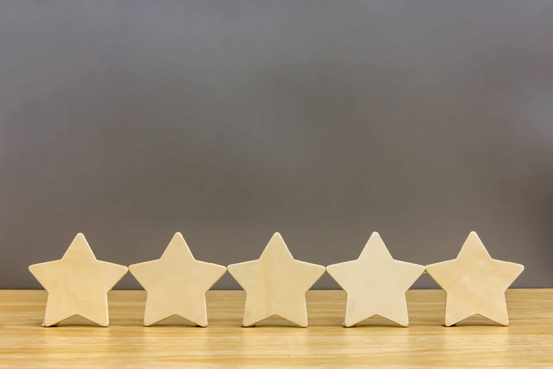 Five stars lined up on a tabletop, indicating high quality.