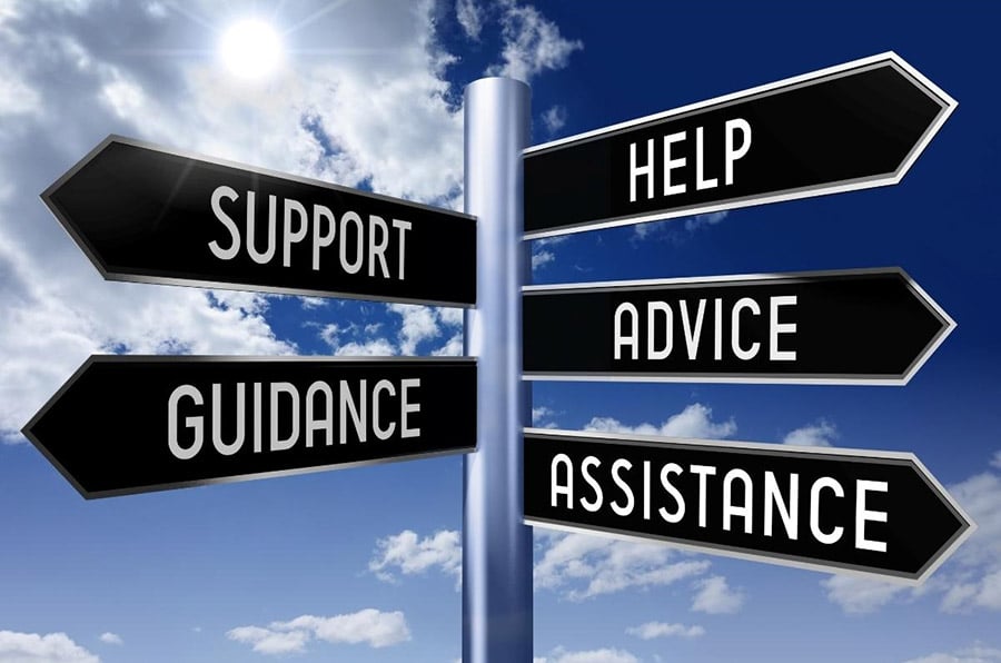 Road sign with words “Support,” “Guidance,” “Help,” “Advice,” and “Assistance” representing Leaf411 services.