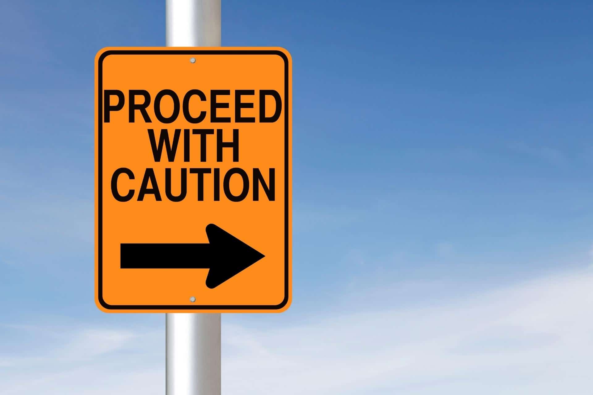 Street sign saying “Proceed with Caution” which is relevant for using RSO.