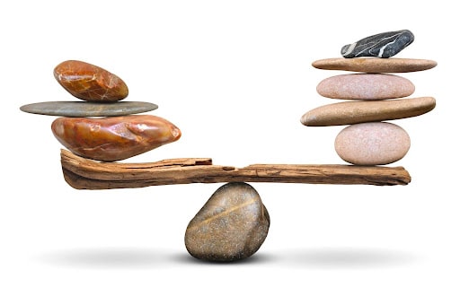 Rocks balanced on wood